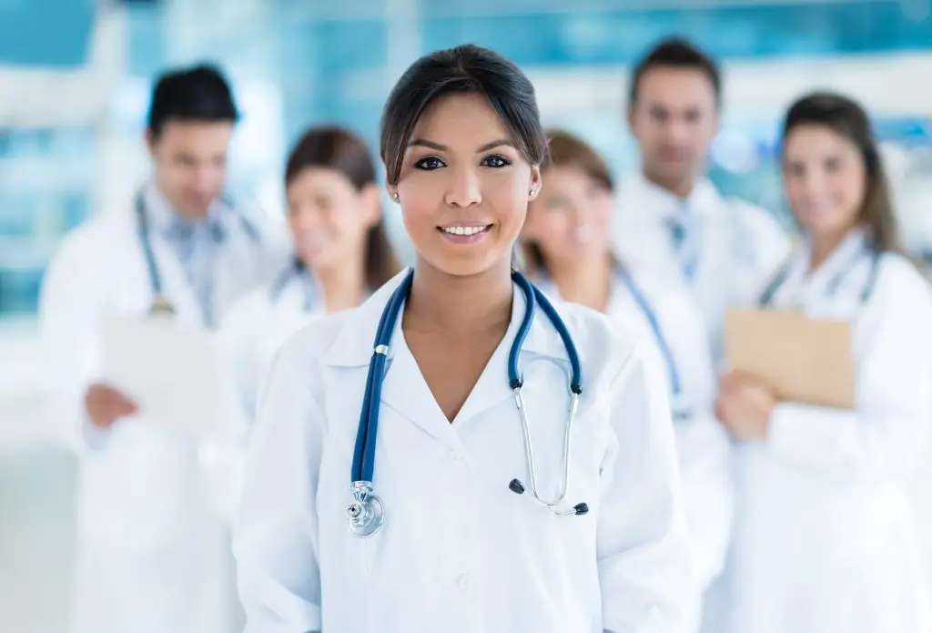 A group of doctors standing in a hospital.