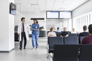 A group of people in a waiting room at a hospital.