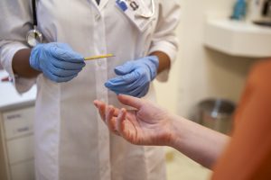 A doctor is giving a patient a test.