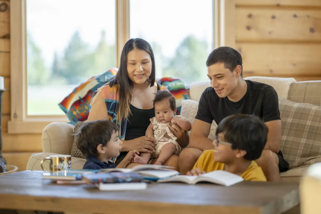 A happy family with a mom, dad and three children.